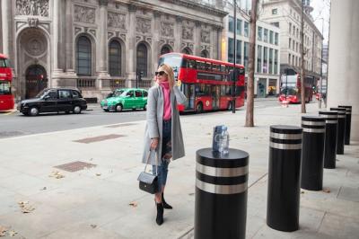 Influencer Taking a Selfie with a Smartphone on a Pylon in the City – Free Download