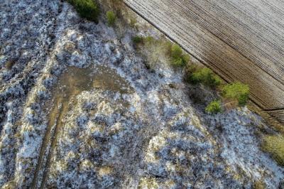 Overhead Shot of an Agricultural Field with Snow Drops in the Countryside – Free Download