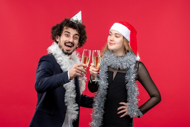 Beautiful Young Couple Wearing Santa Hats – Free Stock Photo for Download