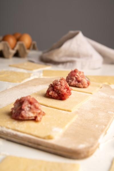 Low Angle Photo of Pasta Being Filled with Meat – Free Download