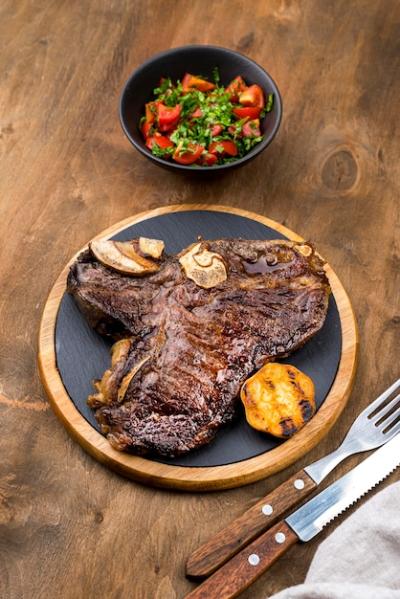 High Angle View of Steak with Salad and Cutlery – Free Download