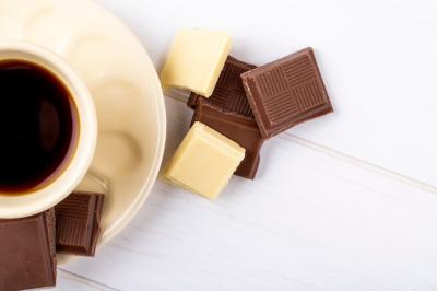 Top View of a Cup of Coffee with White and Dark Chocolate on White Wooden Background – Free Stock Photo, Download for Free