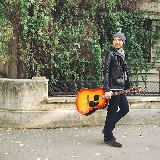 Young Attractive Street Artist with Guitar – Free Download