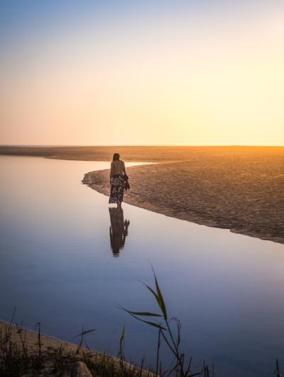 Stunning Female Walking on the Beach at Sunset – Free Download