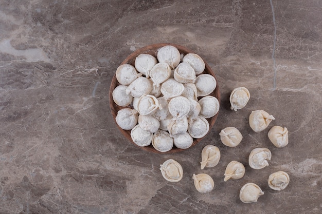 Raw Dumplings on Wooden Board – Free Download