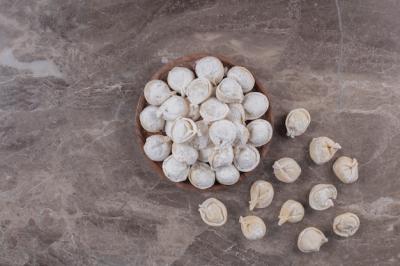 Raw Dumplings on Wooden Board – Free Download