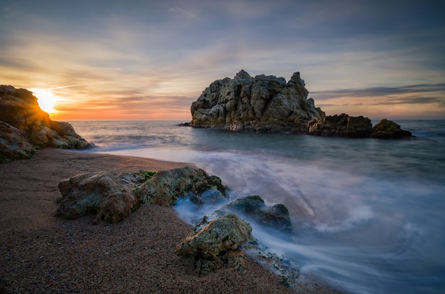 Rocky Island at Sunset by the Beautiful Sea – Free Stock Photo for Download