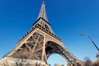 Eiffel Tower Against a Blue Sky in Paris – Free Stock Photo for Download