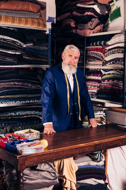 Senior Male Fashion Designer in His Clothes Shop – Free Stock Photo for Download