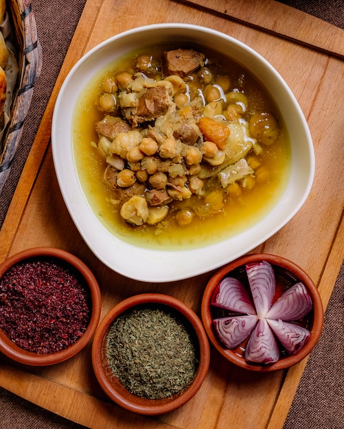 Top View of Traditional Mutton Dish with Peas, Potatoes, and Onions on Wooden Board – Free Stock Photo, Download Free