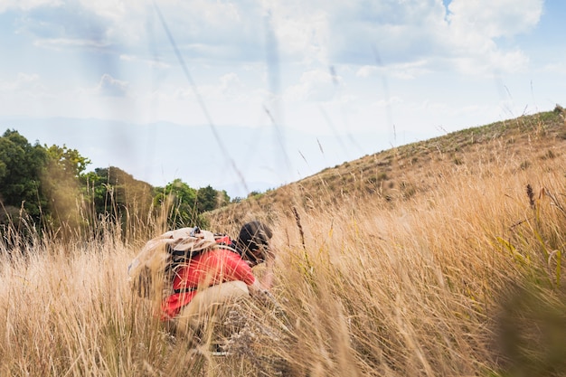 Hiker Touching Ground – Free to Download Stock Photo