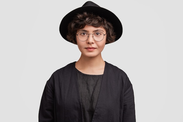 Young Woman in All Black Attire and Round Glasses – Free Download