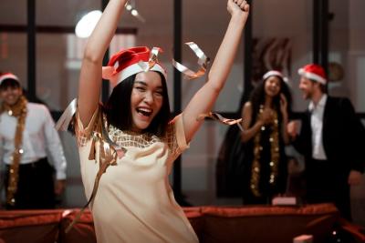 Woman Celebrating in Santa’s Hat – Free Stock Photo for Download