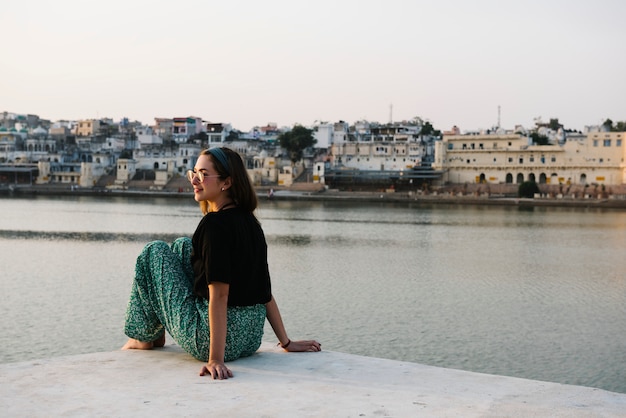 Western Woman Enjoying the Scenic View of Pushkar Lake in Rajasthan – Free Download