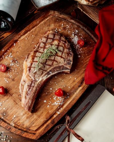 Fried Steak with Spices on Wooden Board – Free Download