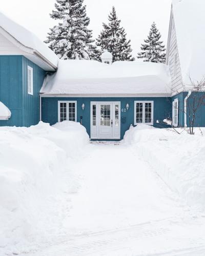 Blue House Covered in White Snow During Winter – Free Stock Photo