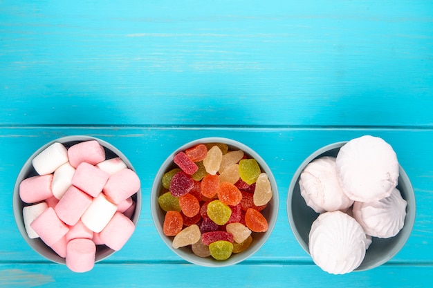 Various Colorful Sweets and Marmalade Candies in Bowls