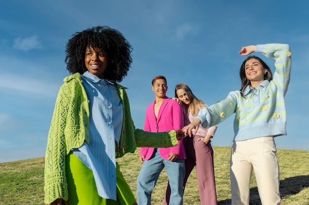 Friends Enjoying Sunshine in an Outdoor Field – Free Download