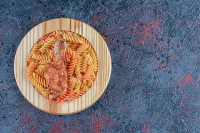 A Wooden Plate of Spiral Macaroni with Chicken Leg Meat – Free Stock Photo, Download Free Stock Photo