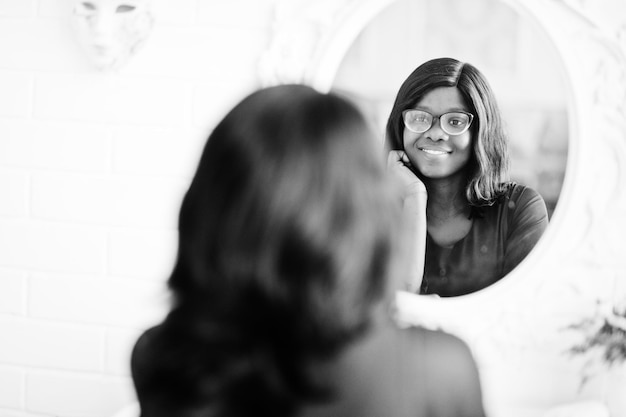 Stunning African American Woman in Eyeglasses Posed by a Mirror – Free to Download