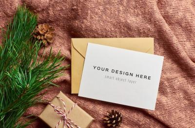 Christmas Gift Box and Pine Tree Branch Greeting Card Mockup – Free Download