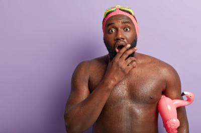 Embarrassed Dark-Skinned Guy Swimming in Pool – Free Stock Photo, Download for Free