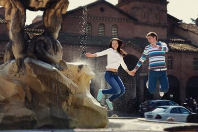 Cheerful Young Couple Jumps Before Fountain in Rome – Free Stock Photo for Download