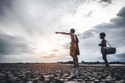 Elderly Men and Boy Discover Fish on Dry Ground Amid Global Warming – Free Download