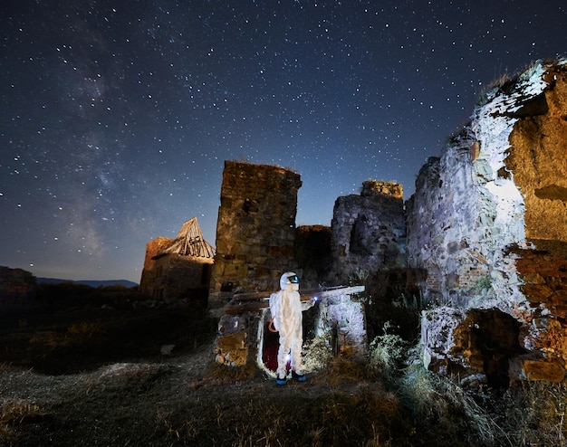 Man in White Suit Exploring Ancient Ruins – Free Stock Photo for Download