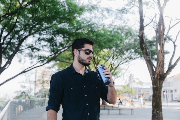 Man in Sunglasses with Thermocup – Free Stock Photo, Download Free Stock Photo