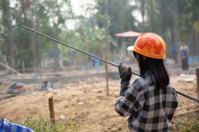 A Group of Steel Rods Tightened by Chains at a Construction Site – Free Download