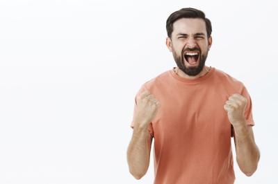 Expressive Bearded Man in Orange Tshirt – Free Download