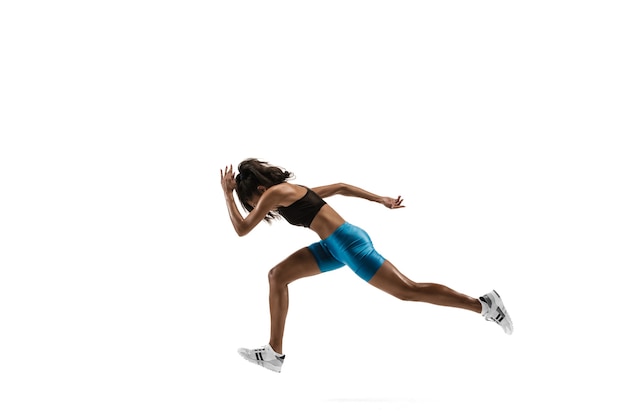 Silhouette of a Young African Woman Jogging in Studio