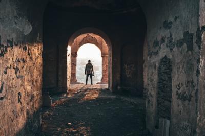 Male Photographer in Archway of Abandoned Architecture – Free Stock Photo, Download for Free