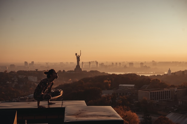 Yoga on a Skyscraper Rooftop in the City – Free Download