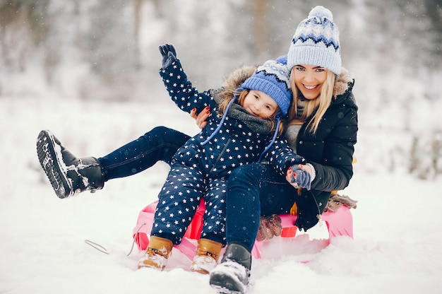 Little Girl and Mother Enjoying Playtime in a Winter Park – Free Stock Photo, Download Free