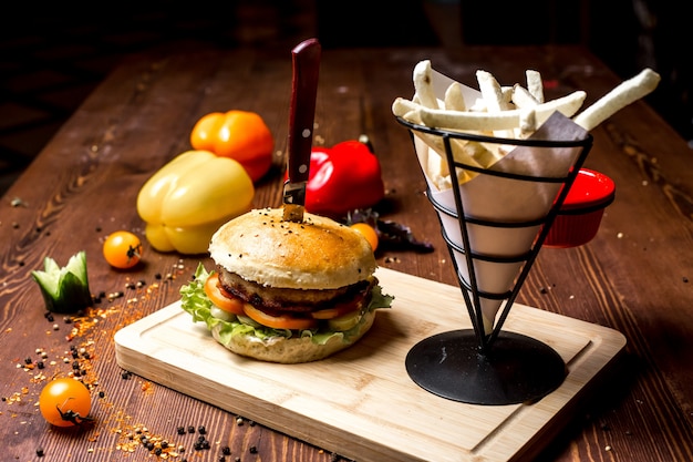 Side View of a Delicious Meat Burger with French Fries and Bell Pepper – Free Stock Photo for Download