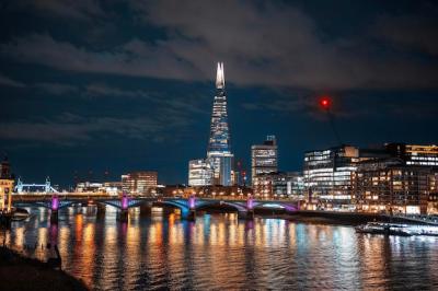 Evening Cityscape of London: Thames River, Bridges, and The Shard Skyscraper – Free Download