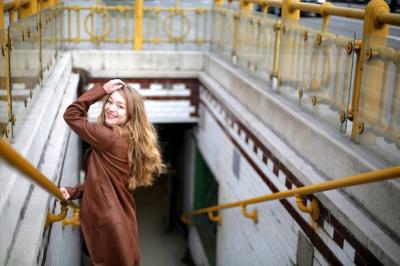 Beautiful Young Blonde Female Smiling on Stairs to the Underground – Free Stock Photo Download