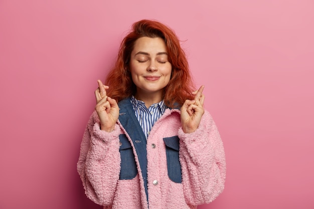 Young Woman with Wavy Ginger Hair Wishing Friends Good Luck – Free Download