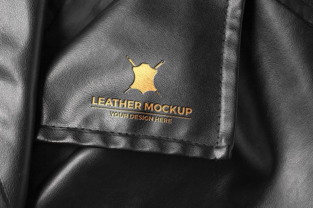 Elegant Gold Logo on Black Leather Material – Free Download