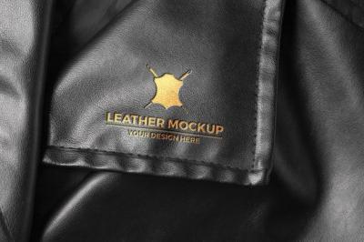 Elegant Gold Logo on Black Leather Material – Free Download