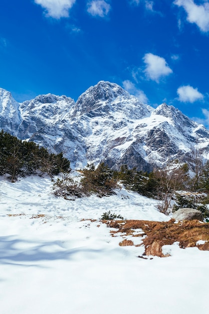 Stunning Snow-Covered Mountain Against Clear Blue Sky – Free Download