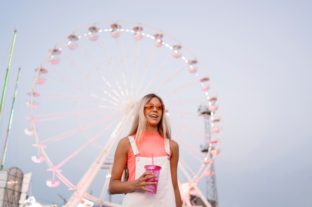 Low Angle Shot of a Girl Holding a Drink – Free Stock Photo, Download Free