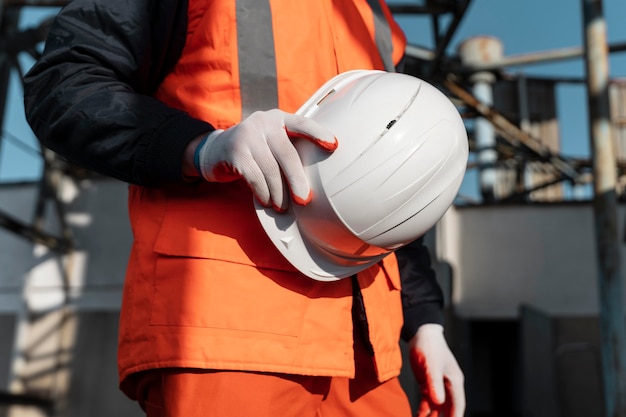 Close Up of a Hand Holding a Safety Helmet – Free Download