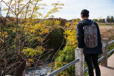 Young Man Sitting on the Bridge – Free Download