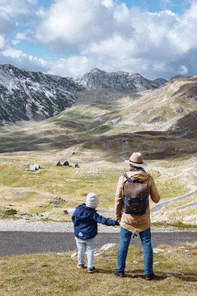 Father and Son Exploring Autumn Mountains in Durmitor, Montenegro – Free Stock Photo Download