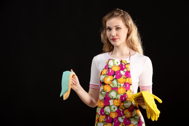 A Young Attractive Girl in Colorful Cape Smiling with Cleaning Gloves – Free Download