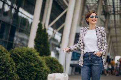 Young Woman at Airport with Luggage – Free Stock Photo for Download