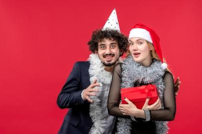 Beautiful Young Couple in Santa Hats – Free Stock Photo, Download Free